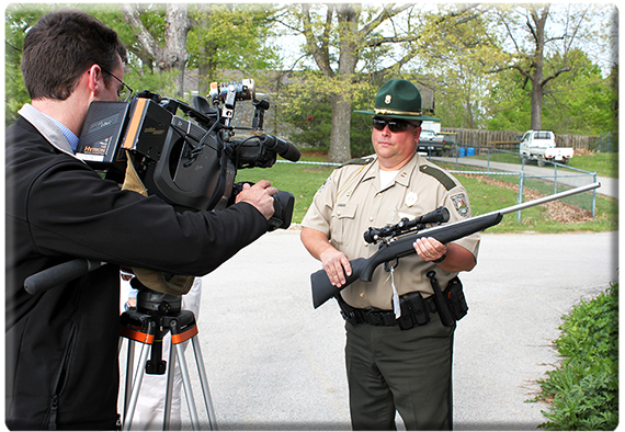 Conservation officer Captain Todd Rogers holds one of the rifles.