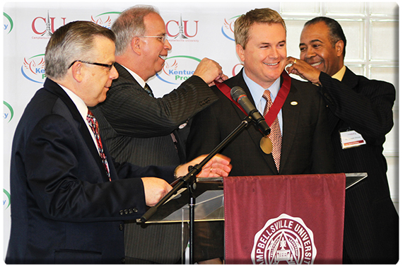 Dr. John Chowning, CU President Michael V. Carter, Commissioner Comer, and Dr. Joseph Owens
